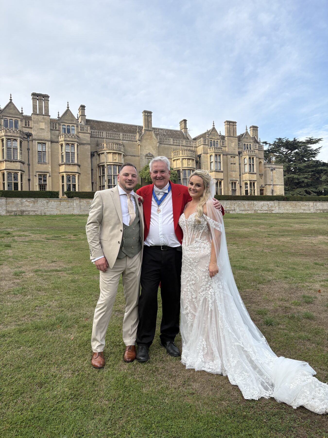 Andrew Morgan with a bride and groom in the grounds of their wedding venue